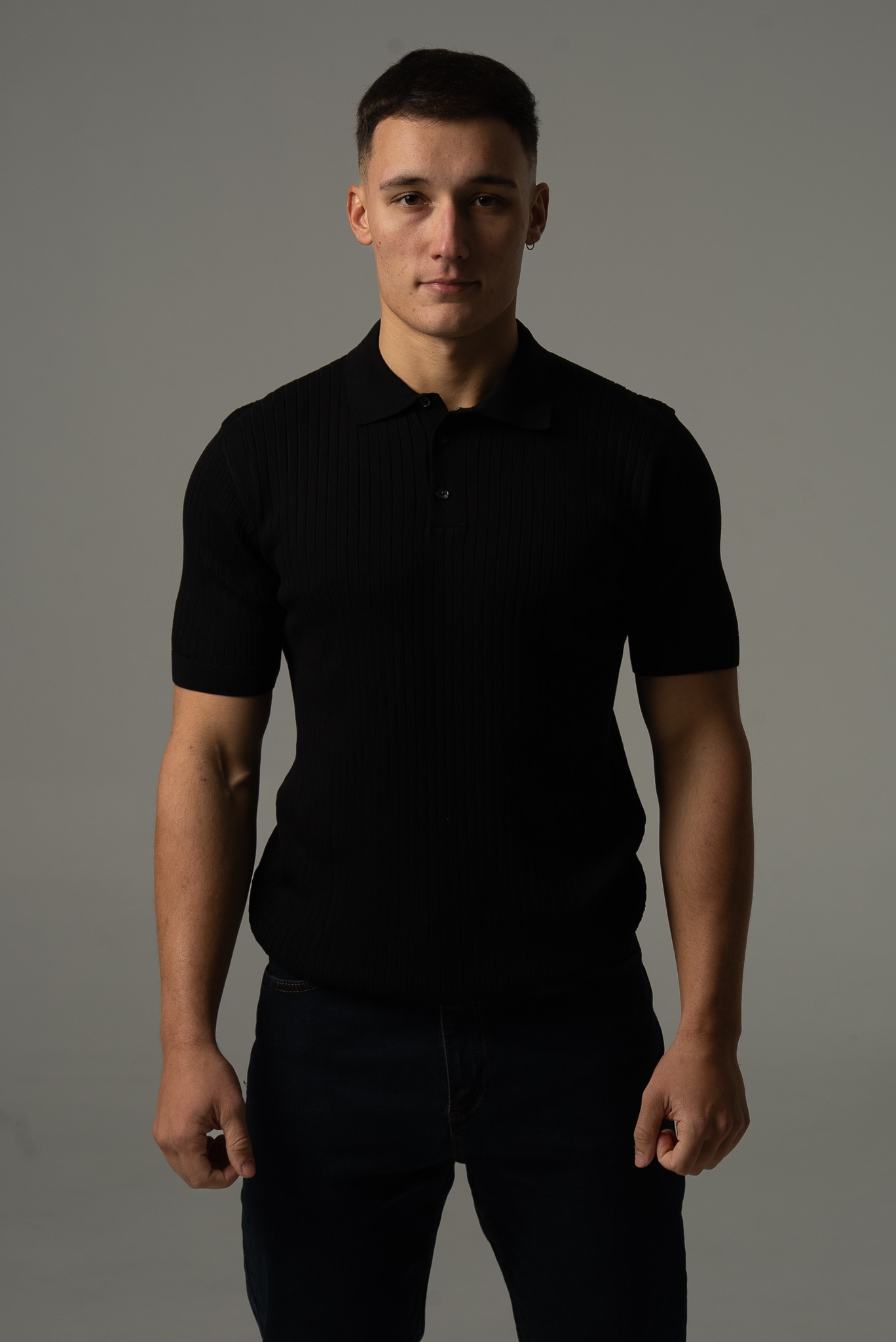 Men's black polo shirt in sweater knit with short sleeves